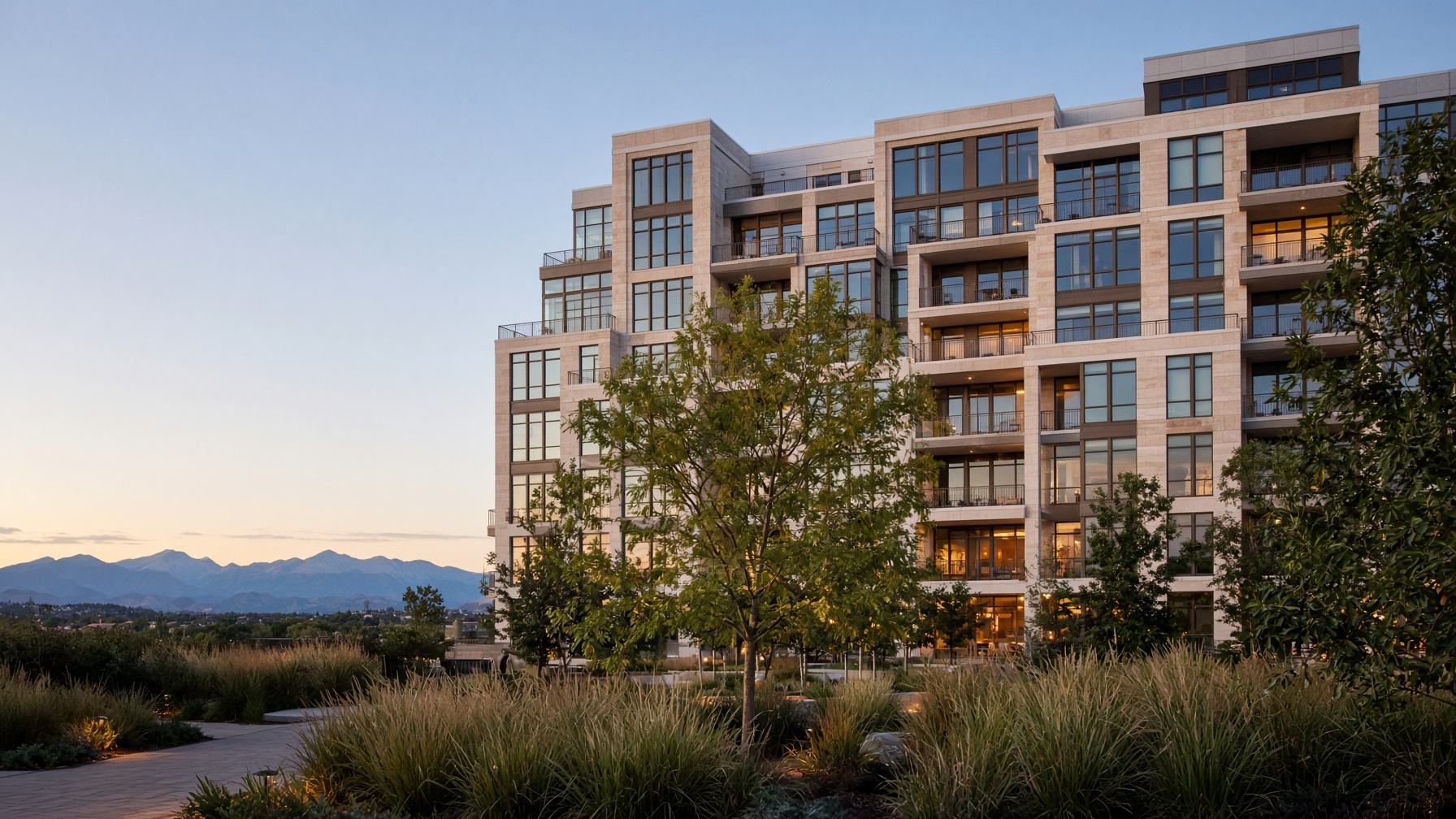 Class A multifamily mid-rise at dusk along the Front Range